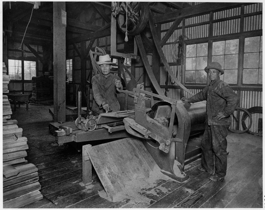 Men working with a barrel machine at Sweeney Cooperage Ltd. Photo: Vancouver Public Library 3542.