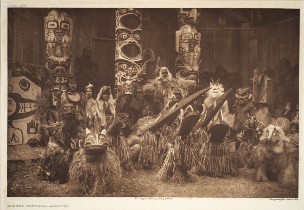 A Kwakwaka’wakw potlatch with dancers and singers in 1914. Photo: Edward Curtis.