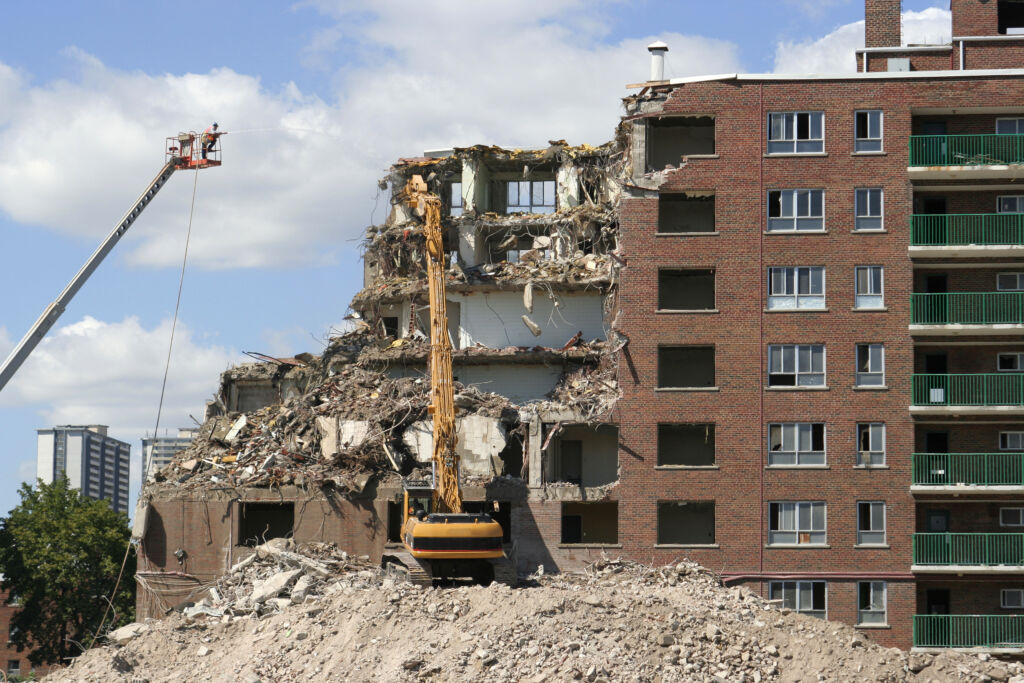 Demolition of the Regent Park public housing buildings. The plan to gentrify Regent Park began in 2005. While the project is considered a success by planners, many community members including researcher Dwayne Sybbliss point to its damaging effects, including the negative impact that gentrification has had on the Black men in Regent Park